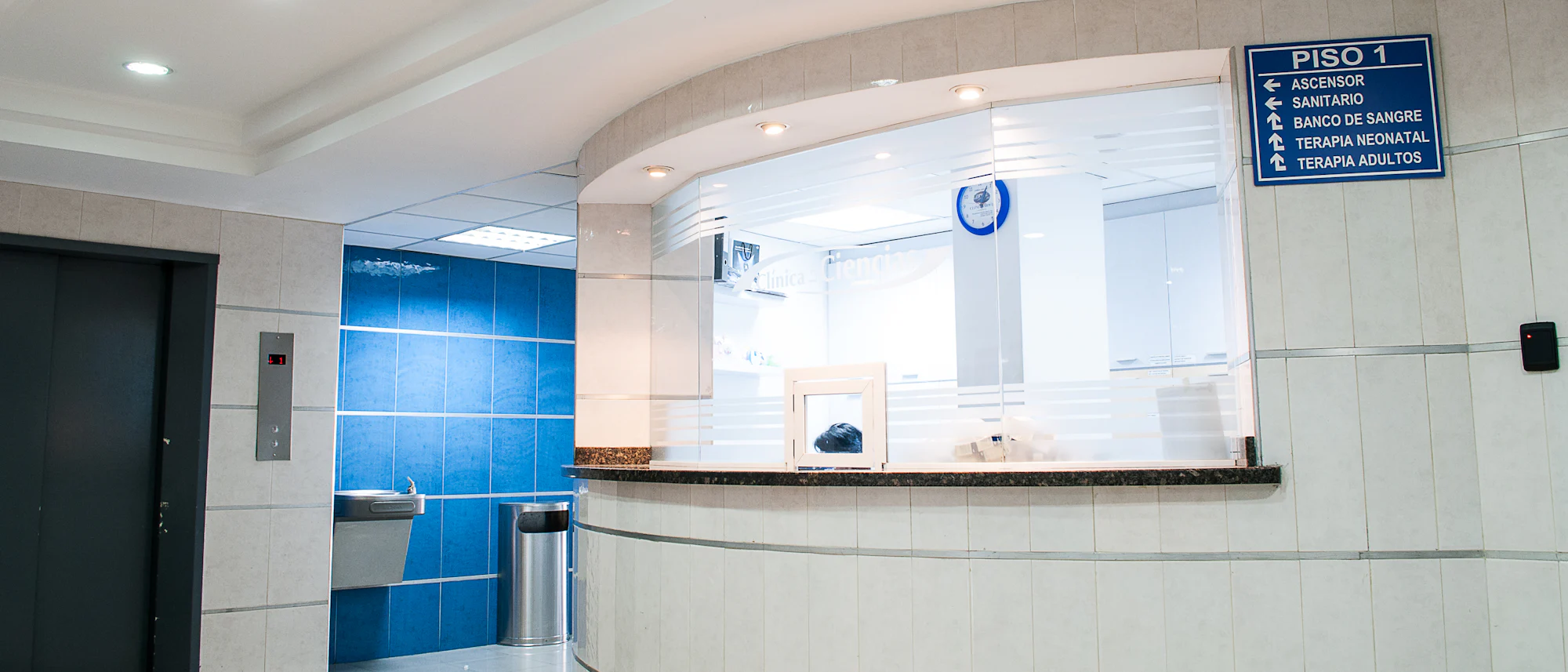 Nurses and physicians conferring in a bright hospital corridor